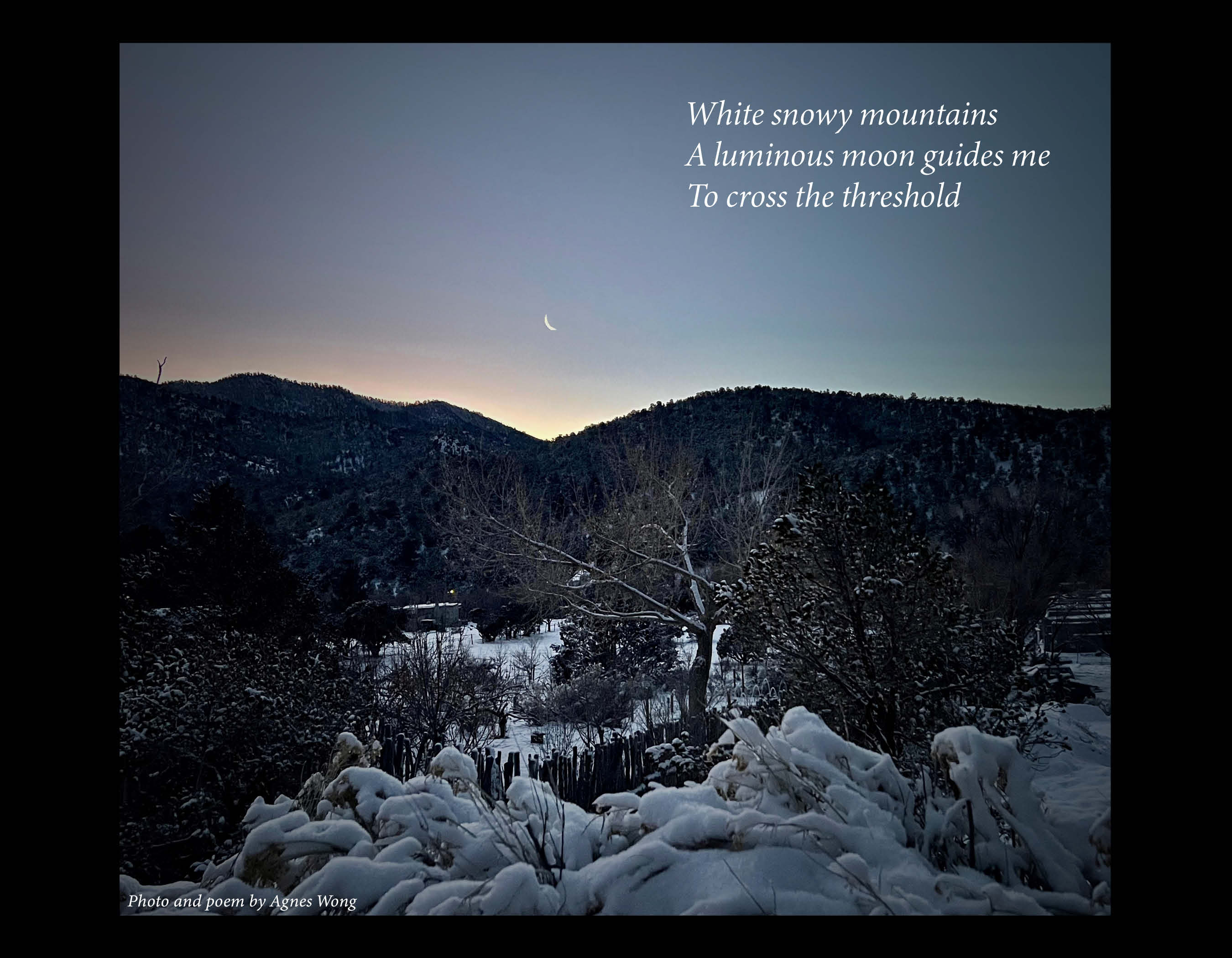 A small crescent moon hangs above dark mountain ridges and a snow-covered landscape.